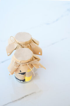 Glass jar full of socks with paper cover