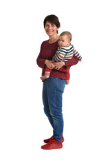 side view of a mother carrying her baby looking at camera on white background
