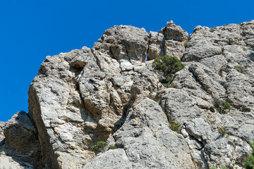 Crimean rocks and sky. Sunny autumn day. Front view