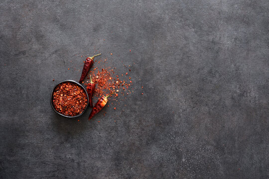 Dry chili peppers on a black background. Spice. Paprika.
