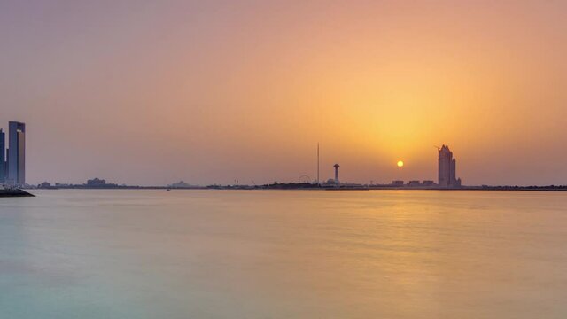 Sunset in Abu Dhabi over Marina Island timelapse