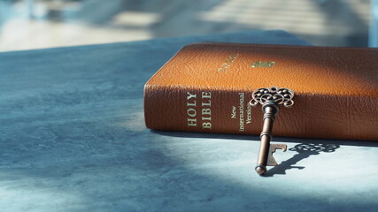 Key and bible on grey marble. Concept bible is key of life.  Key  Salvation is in bible. ...