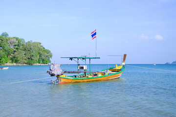 Plakat Fishing boat moored at beach Phuket Thailand