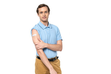 Man with medical path on arm looking at camera isolated on white