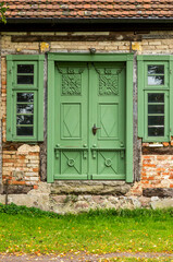 Fototapeta na wymiar Massive Wooden Historic Door In Old House