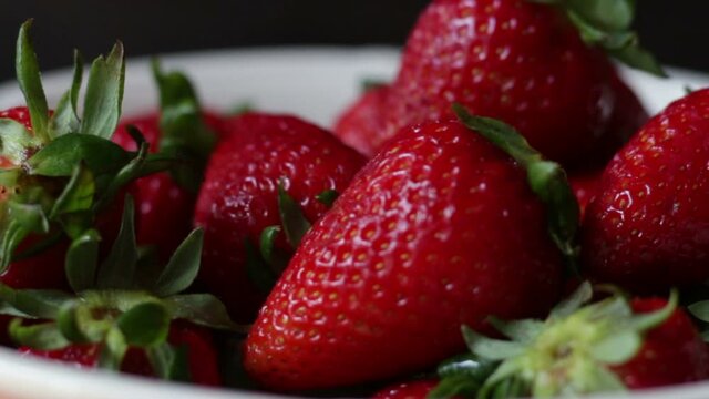 Fresh strawberries in white bowl
