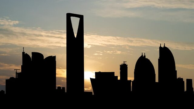 Riyadh City Towers in Saudi Arabia, Time Lapse at Sunrise with Colorful Clouds