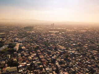 Dramatic hazy early morning scene of Pasig, Cainta and far away Antipolo cityscape.