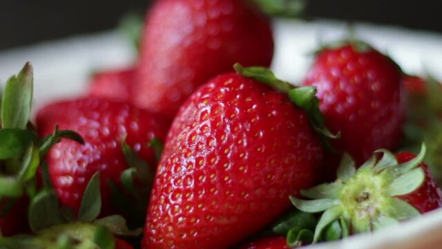 Fresh strawberries in white bowl
