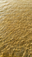 Scenic view of Sunlight makes beautiful shadows of ripples in the sand in shallow seawater - One of the major tourists attracted places in the southern province, Sri Lanka.