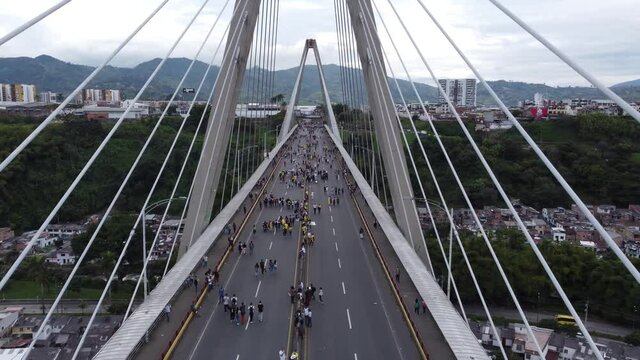 Pereira, Risaralda Colombia - April 28, 
 2021: Aerial View of a march of Colombians demanding rights and against tax reform Viaducto C&eacute;sar Gaviria Trujillo
