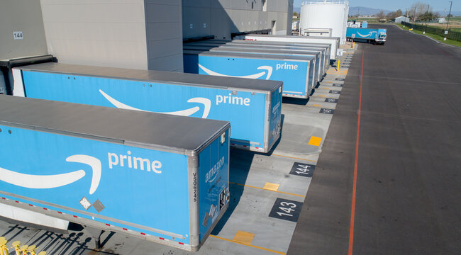 amazon trucks waiting to loaded up for delivery