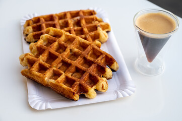 Belgian sugar waffles with black coffee served outdoor