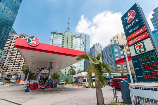 Ortigas, Metro Manila, Philippines - April 2021: A Caltex gas station at the intersection near a business district.