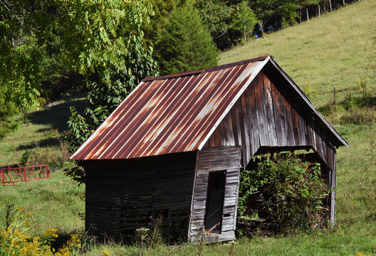 Smal Barn Has Tin Roof and Open Door
