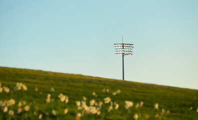 The floodlight in the evening with a soft yellow, blue sky.