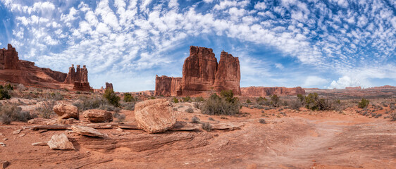 Panoramic American landscape view of the red rock canyons. Dramatic Blue Sky Artistic Render. Taken...