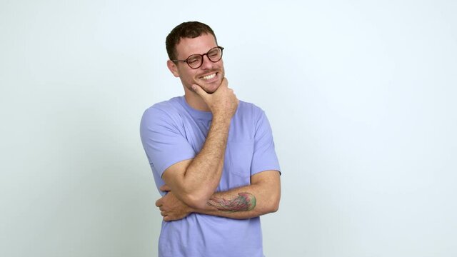 Brazilian handsome man with glasses standing and looking to the side over isolated background