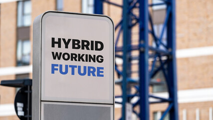 Hybrid working future sign in a city setting under construction
