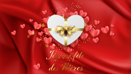 carte ou bandeau sur une Joyeuse Fête des Mères en or avec au dessus un cadeau en forme de coeur blanc avec son noeud or et tout autour des coeurs rose sur un fond drapé rouge avec des paillettes or