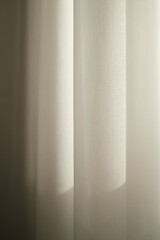 Tulle curtain. Sunlit curtain. Wavy fabric surface.