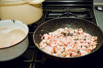 Cooking at home on the stove.