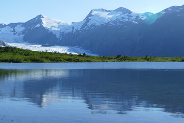 Naklejka premium Portage Lake with glacier, popular hiking and tourist guided tour destination, Kenai Fjords National Park, Alaska, United States