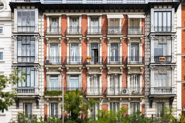 Naklejka premium Traditional windows and balconies in Madrid’s city center.