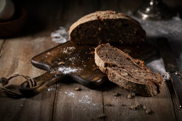 Black rye bread on a rustic table