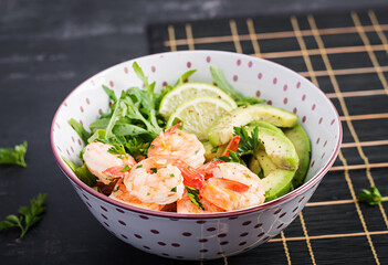Salad of prawns. Salad of shrimps, arugula, avocado slice, close up. Healthy concept.