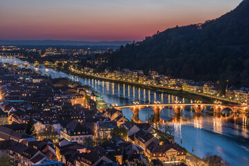 Heidelberg panorama with old city, old bridge and Neckar river after sunset. Beautiful illuminated. - obrazy, fototapety, plakaty