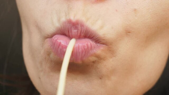 macro close up lips mouth sucking spaghetti string