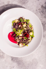 fresh salad served in a dish with direct hard light