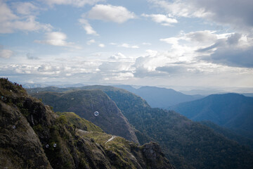 Fototapeta premium landscape photograph where the hills and the clouds meet.