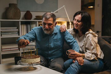 middle age couple celebrating anniversary at home