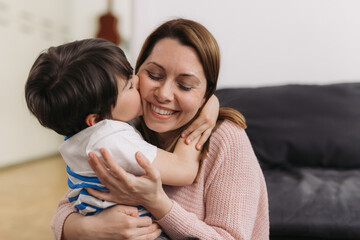 mother hugging and kissing with her son