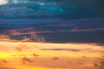 Sunrise Sky. Bright Dramatic Sky With Colorful Clouds. Yellow, Orange And Blue Colours
