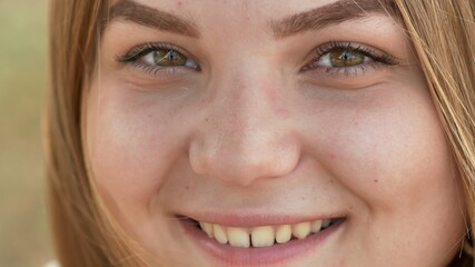 Close up of young smiling girl face.