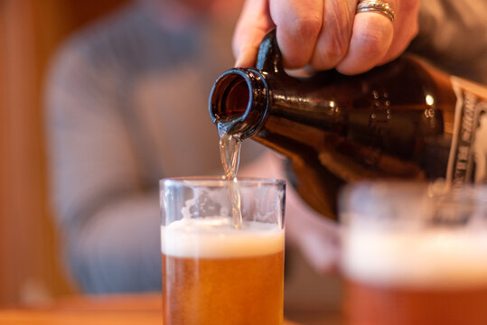 Pouring Beer From A Growler