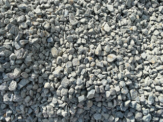 Abstract white crushed stones texture background. Gray rubble construction rock pebble pattern