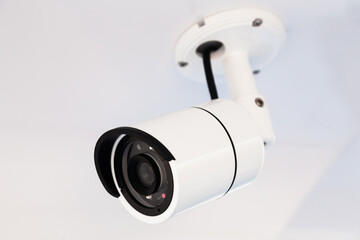 CCTV camera on the hull of an expensive motor yacht. CCTV camera white on a white body.