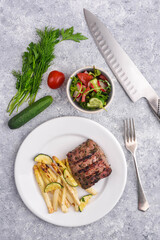 Venison BBQ Steak with the grilled asparagus, courgettes, fennel, tomatoes and garlic dill sauce