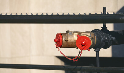 Close up picture of a standpipe on a street of New York, selective focus, USA.