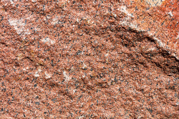 Stone texture of red granite. High resolution, close-up.