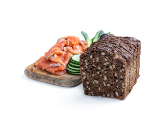 Rye bread with seeds and smoked salmon isolated on white
