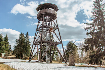 Wooden observation tower called Anna on Anensky Peak in Orlicke Mountains,Czech Republic.Spiral staircase of lookout tower, construction with metal steps and oak platform.Czech tourist place.