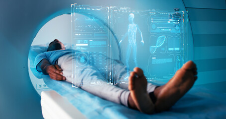 Black patient in futuristic CT machine