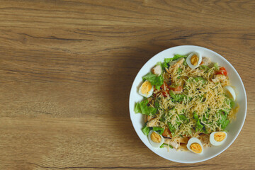Light diet salad on a wooden background