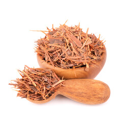 Lapacho herbal tea in wooden bowl, isolated on white background. Natural Taheeboo dry tea. Pau...