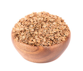Dill seeds in wooden bowl, isolated on white background. Natural dry dill seeds. Anethum graveolens.